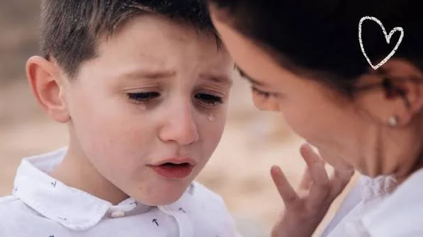 A parent taking a breath after a difficult moment with their child